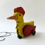 Vintage Wood Duck with a Hat on Wheels Decorative Object