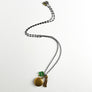 PATCH NYC Treasure Necklace: Vintage Gold Tone Locket with Tassel & Lucky Clover