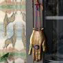 Brass Jeweled Hand with Orange Ribbon Wall Art