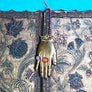 Brass Jeweled Hand with Pink Ribbon Wall Art