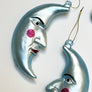 Rosy Cheek Crescent Moon Man Blue Glass Ornament