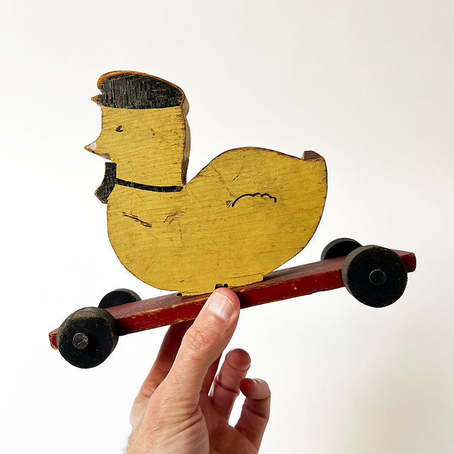 Vintage Wood Duck in a Cap on Wheels