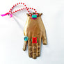 Jeweled Brass Hand with Red & White Beads Wall Art