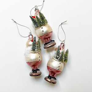 Snowman Holding Trees in Front Glass Ornament