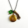 PATCH NYC Treasure Necklace: Vintage Gold Tone Locket with Tassel & Lucky Clover