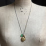 PATCH NYC Treasure Necklace: Vintage Gold Tone Locket with Tassel & Lucky Clover