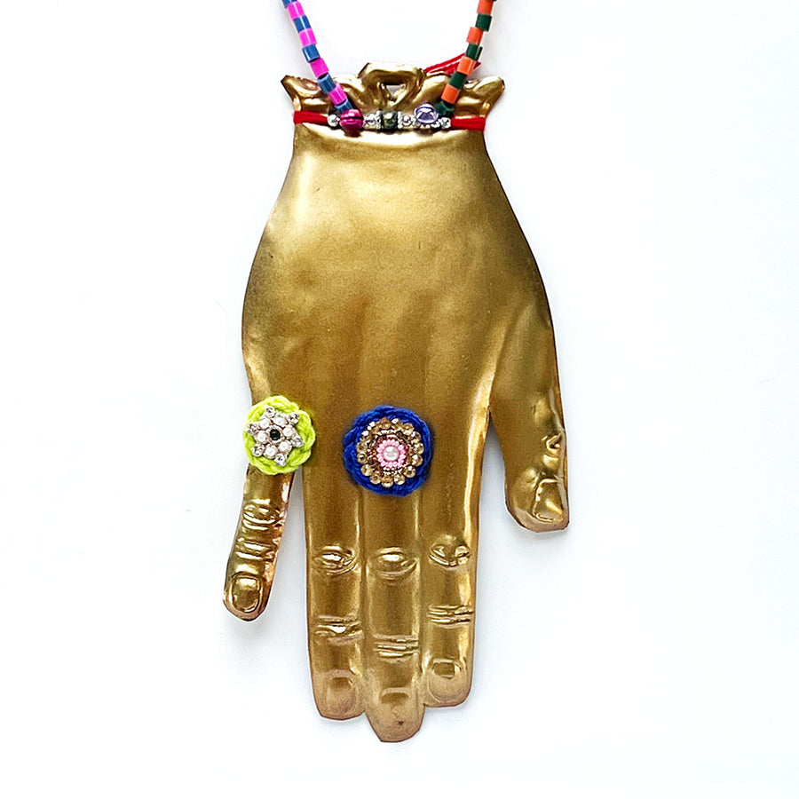 Brass Jeweled Hand with Orange Ribbon Wall Art